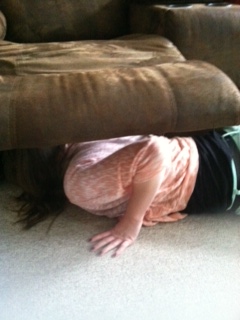 Lyn looking for the key.  She's the only one who could get that far under the couch.